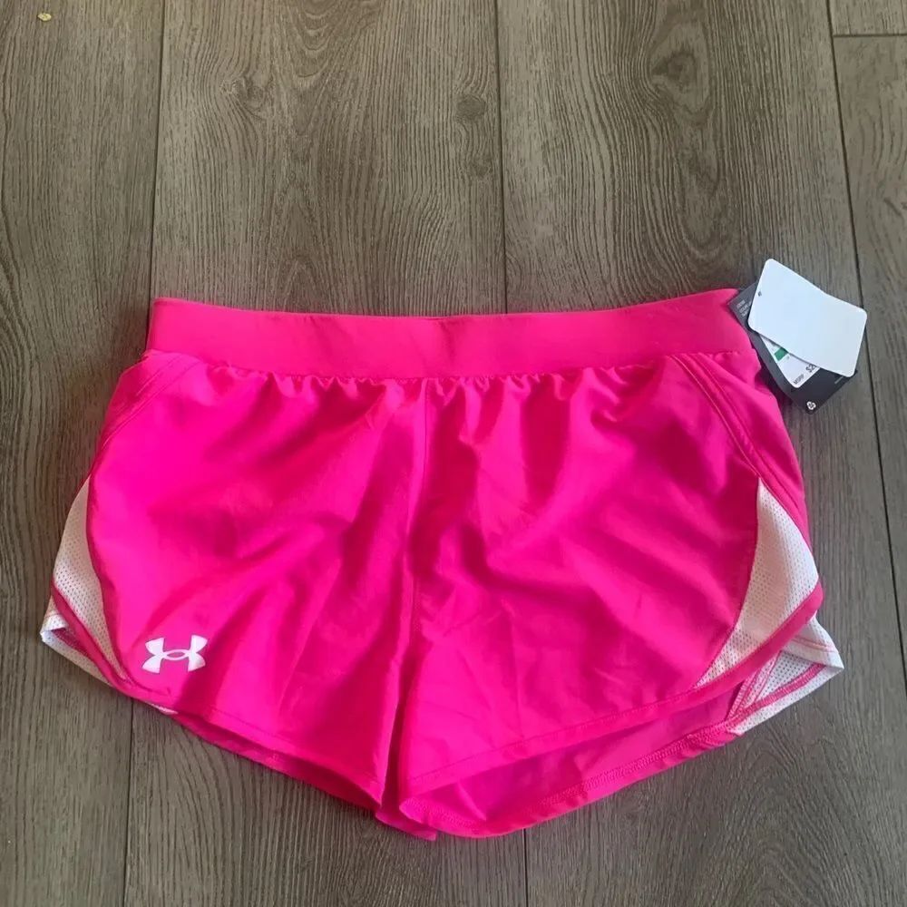 Under Armour girls pink and white shorts. Perfect for any sport practice
